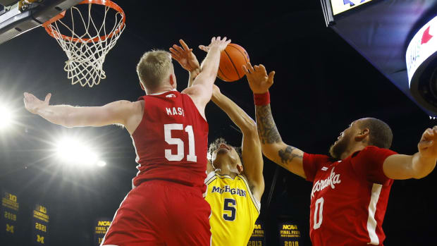 Mar 10, 2024; Ann Arbor, Michigan, USA; Nebraska Cornhuskers forward Rienk Mast (51) blocks a shot by Michigan Wolverines forward Terrance Williams II (5) during the first half at Crisler Center.